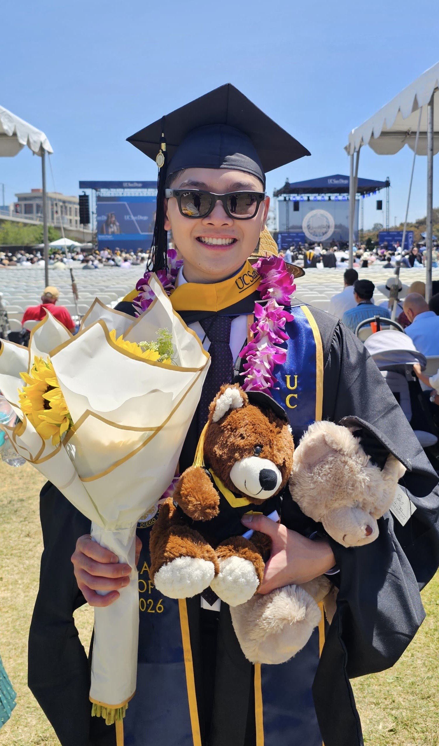 Melvyn standing at graduation